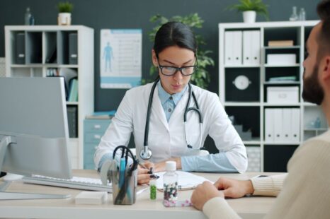 Doctor consulting a patient in a modern clinical office