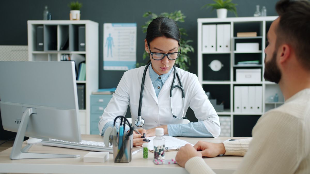 Doctor consulting a patient in a modern clinical office
