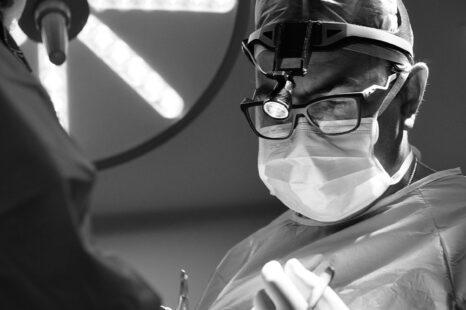 Surgeon focused during a rhinoplasty procedure in the operating room