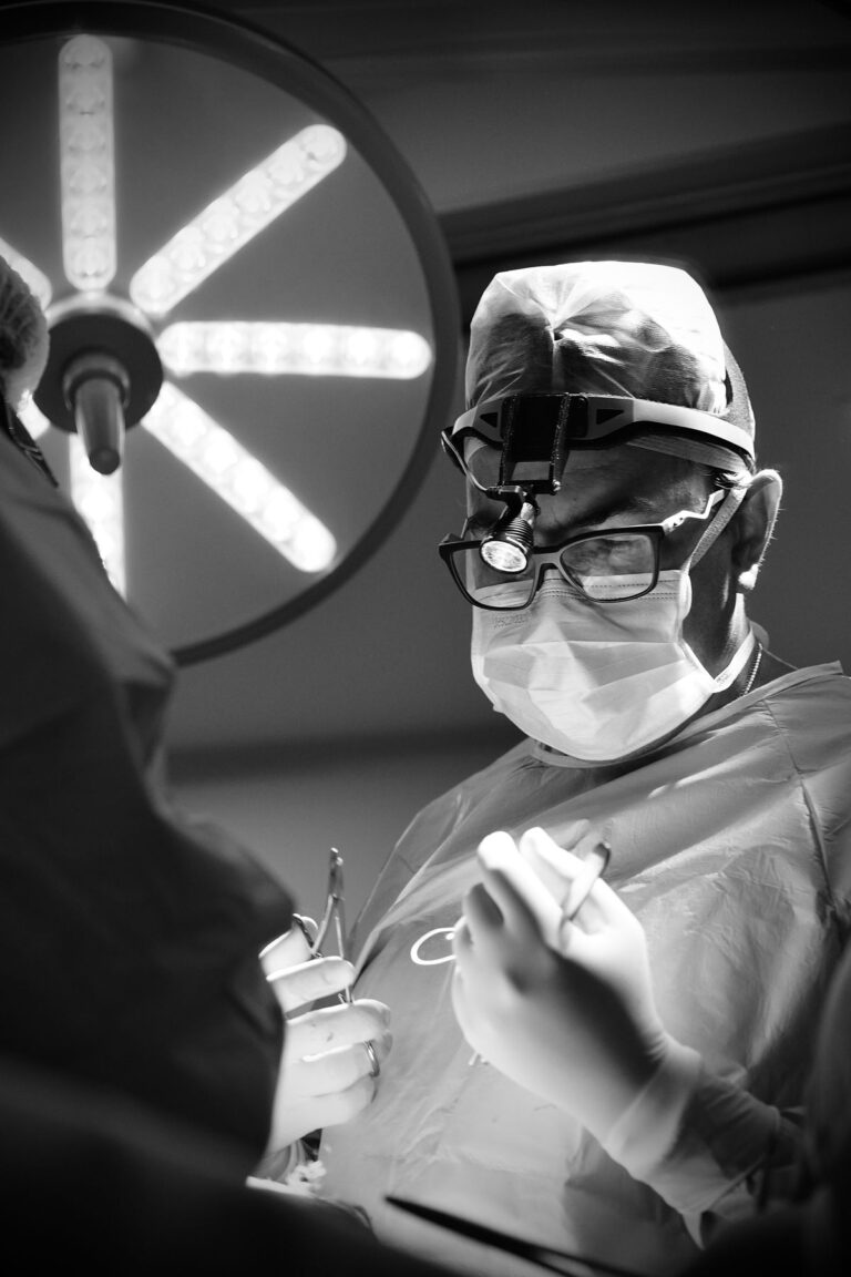 Surgeon focused during a rhinoplasty procedure in the operating room