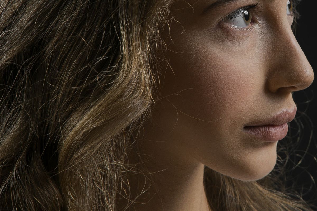 Close-up side profile of a woman showing the nose, lips and chin